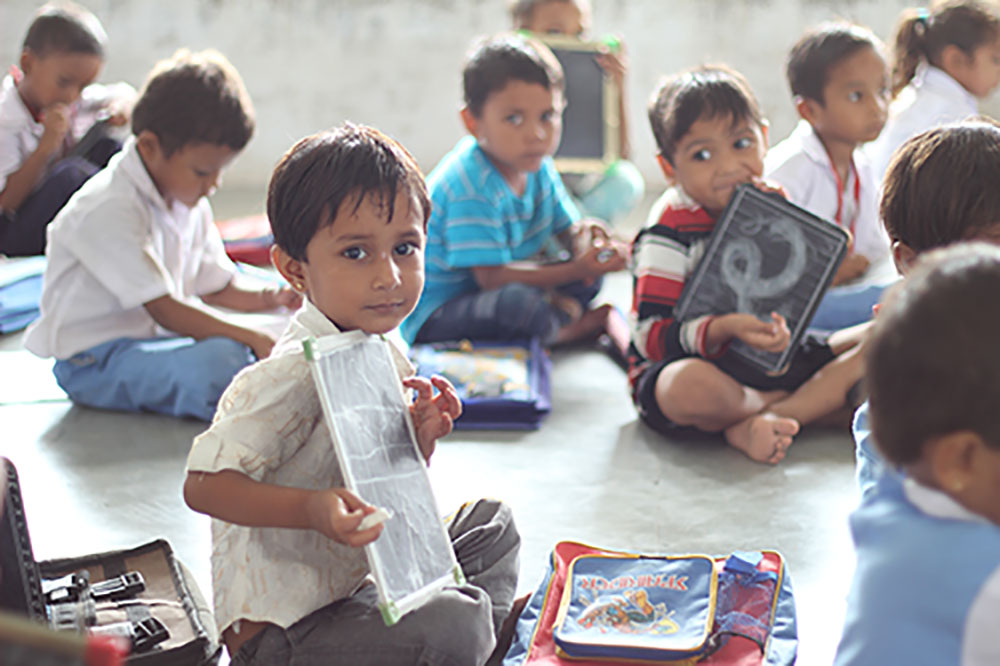 Kids holding chalkboards